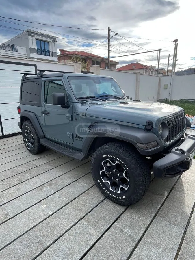 Jeep Wrangler Sport 2023 — фото 1, купить с доставкой в Москву